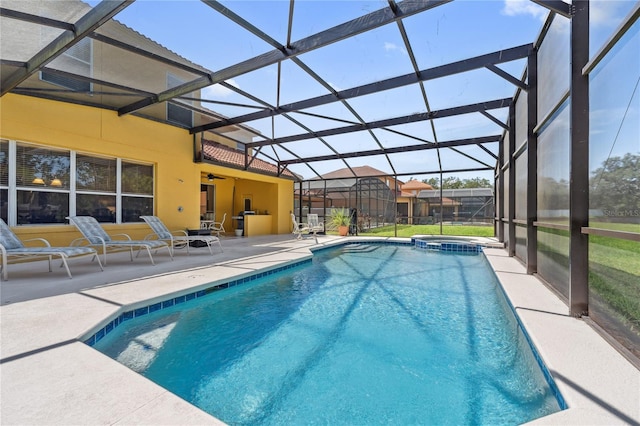 143 Tiger Lily Ct, Davenport, FL 33837 - view of pool with a patio, a pool with connected hot tub, ceiling fan, and glass enclosure