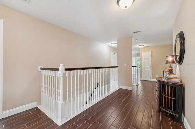 143 Tiger Lily Ct, Davenport, FL 33837 - corridor with wood tiled floors and baseboards