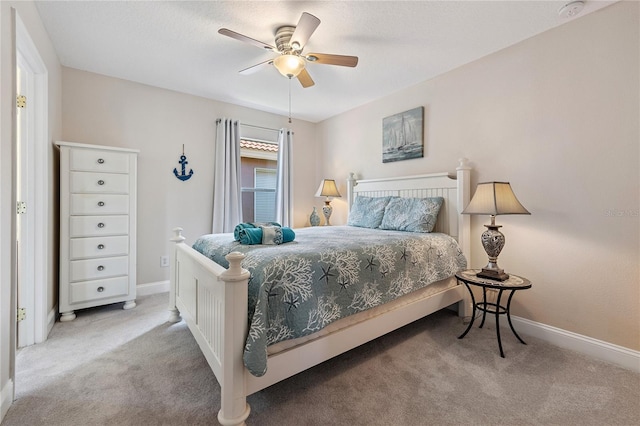 143 Tiger Lily Ct, Davenport, FL 33837 - carpeted bedroom with baseboards and a ceiling fan