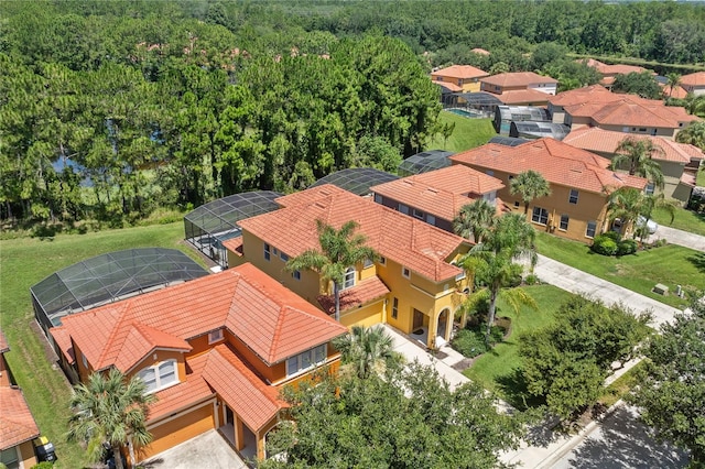 143 Tiger Lily Ct, Davenport, FL 33837 - aerial perspective of suburban area featuring a heavily wooded area