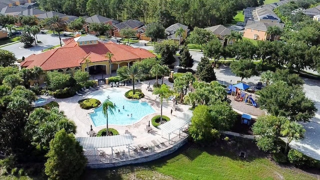 143 Tiger Lily Ct, Davenport, FL 33837 - aerial perspective of suburban area with a pool area