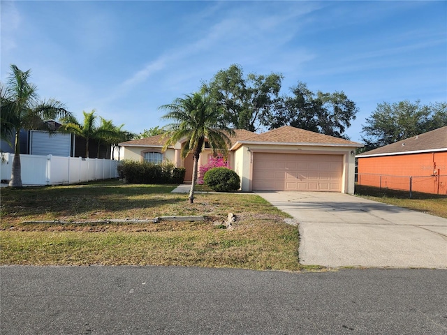 1150 Orne Ct, Kissimmee, FL 34759 - ranch-style home with driveway, a garage, and stucco siding
