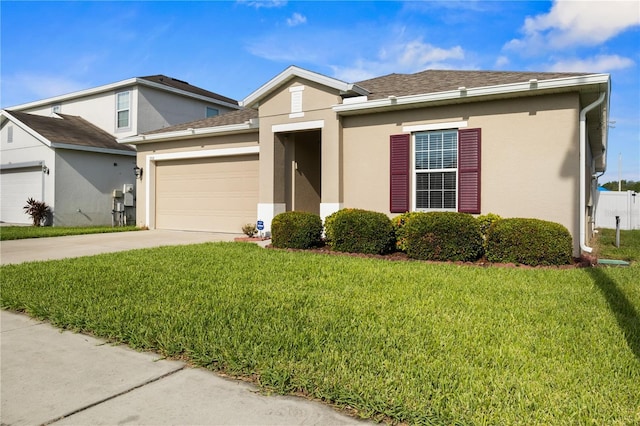 555 Lucerne Blvd, Winter Haven, FL 33881 - view of front of house with an attached garage, a front lawn, driveway, and stucco siding