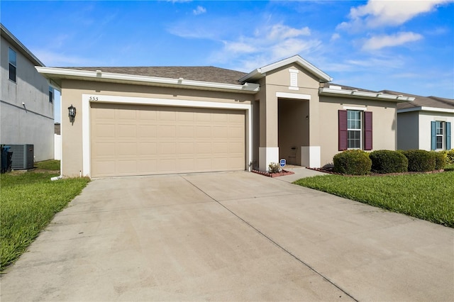 555 Lucerne Blvd, Winter Haven, FL 33881 - ranch-style home featuring concrete driveway, stucco siding, a garage, and a front lawn