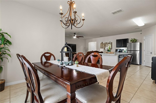 555 Lucerne Blvd, Winter Haven, FL 33881 - dining area featuring a chandelier, light tile patterned floors, and a ceiling fan