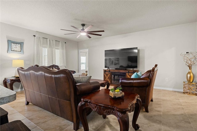 555 Lucerne Blvd, Winter Haven, FL 33881 - living area with a ceiling fan, light tile patterned floors, and a textured ceiling