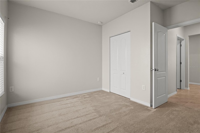 555 Lucerne Blvd, Winter Haven, FL 33881 - unfurnished bedroom featuring carpet flooring and a closet