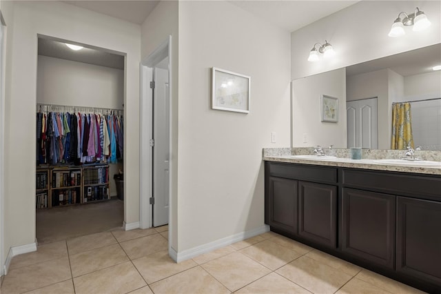 555 Lucerne Blvd, Winter Haven, FL 33881 - full bath with double vanity, tile patterned flooring, a walk in closet, and a shower with curtain