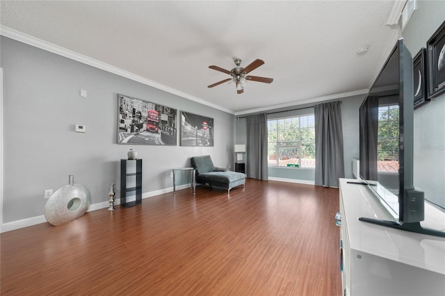 5548 Metrowest Blvd Unit 202, Orlando, FL 32811 - sitting room with a ceiling fan, crown molding, and wood finished floors