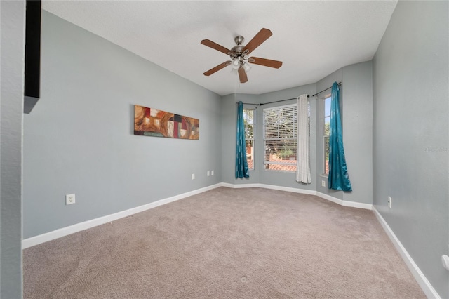 5548 Metrowest Blvd Unit 202, Orlando, FL 32811 - carpeted empty room featuring a ceiling fan and baseboards