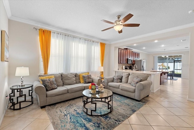 2511 Nouveau Way, Kissimmee, FL 34741 - living room with light tile patterned flooring, ceiling fan, and crown molding
