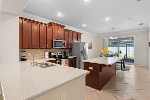 2511 Nouveau Way, Kissimmee, FL 34741 - kitchen with stainless steel appliances, ornamental molding, light countertops, a kitchen breakfast bar, and light tile patterned floors