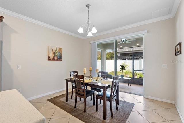 2511 Nouveau Way, Kissimmee, FL 34741 - dining room featuring light tile patterned flooring, crown molding, and a chandelier