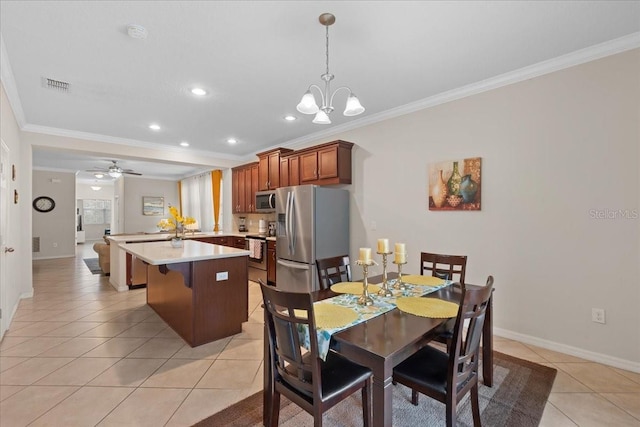 2511 Nouveau Way, Kissimmee, FL 34741 - dining space with crown molding, light tile patterned flooring, a chandelier, recessed lighting, and ceiling fan