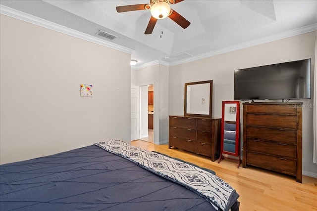 2511 Nouveau Way, Kissimmee, FL 34741 - bedroom with light wood finished floors, crown molding, and ceiling fan