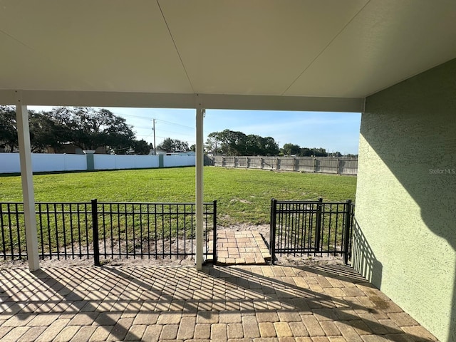 6003 Live Oak Dr, Winter Haven, FL 33880 - fenced backyard with a patio area