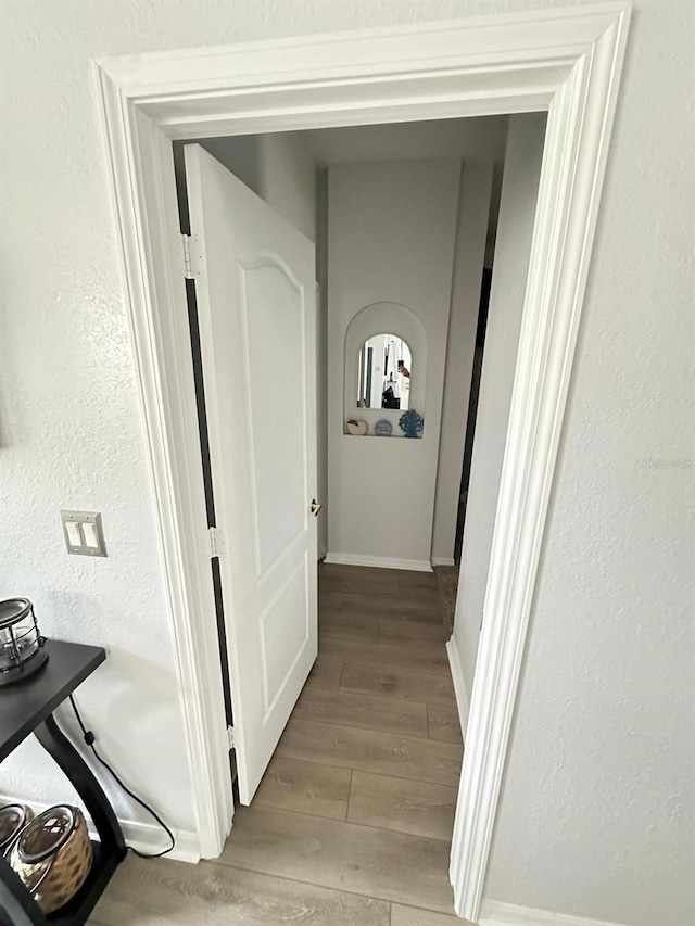 6003 Live Oak Dr, Winter Haven, FL 33880 - hall with light wood-style floors and a textured wall
