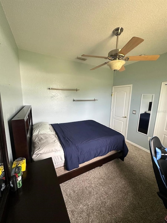 6003 Live Oak Dr, Winter Haven, FL 33880 - carpeted bedroom with a textured ceiling and a ceiling fan