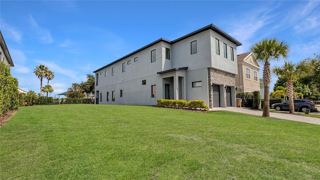 7551 Excitement Dr, Reunion, FL 34747 - view of property exterior with a garage, stucco siding, driveway, stone siding, and a yard