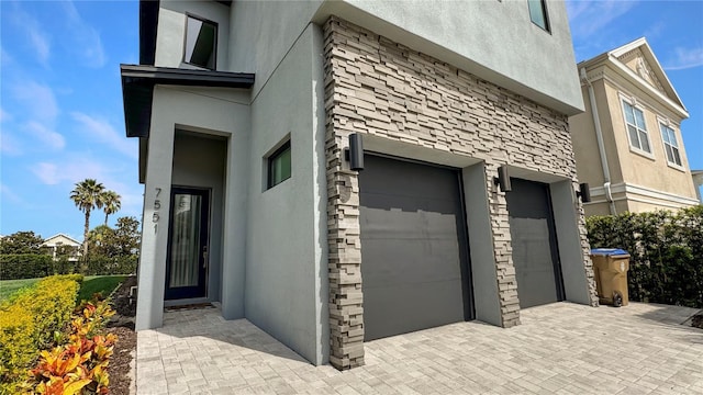 7551 Excitement Dr, Reunion, FL 34747 - garage with decorative driveway