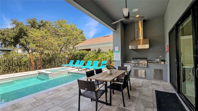 7551 Excitement Dr, Reunion, FL 34747 - view of pool featuring an outdoor kitchen, a pool with connected hot tub, a patio, a ceiling fan, and outdoor dining area