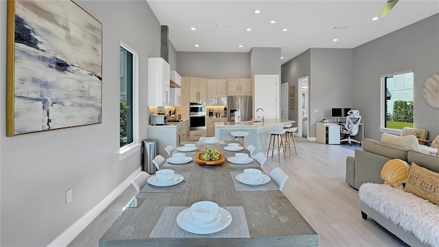 7551 Excitement Dr, Reunion, FL 34747 - dining area with recessed lighting, light wood finished floors, and an office area