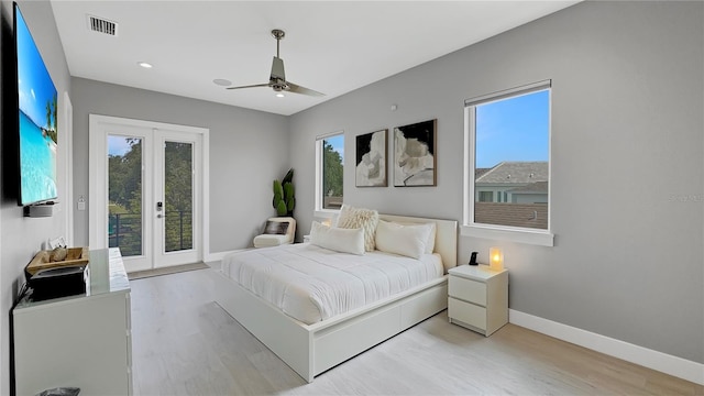 7551 Excitement Dr, Reunion, FL 34747 - bedroom with light wood finished floors, access to exterior, french doors, a ceiling fan, and recessed lighting