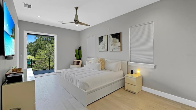 7551 Excitement Dr, Reunion, FL 34747 - bedroom with access to exterior, light wood finished floors, recessed lighting, and a ceiling fan