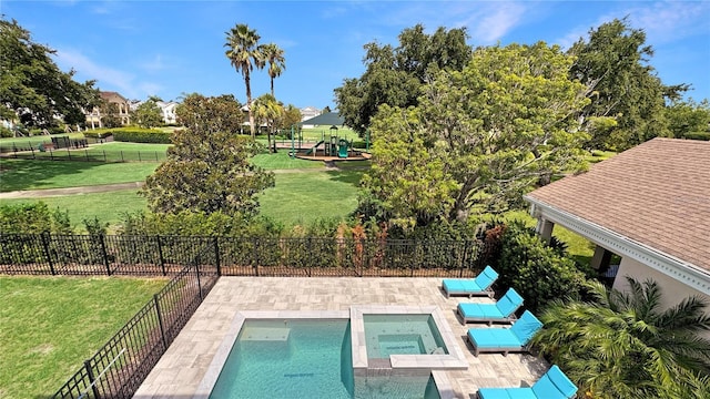 7551 Excitement Dr, Reunion, FL 34747 - view of swimming pool with a patio, a fenced backyard, and a pool with connected hot tub
