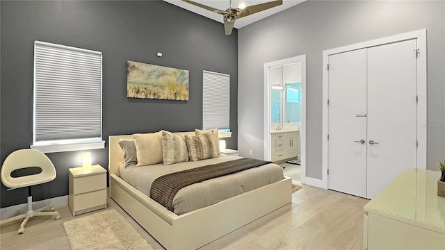 7551 Excitement Dr, Reunion, FL 34747 - bedroom with light wood-type flooring, connected bathroom, a ceiling fan, and a closet