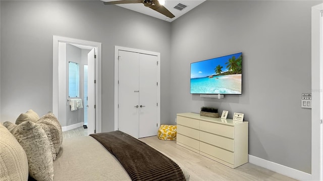7551 Excitement Dr, Reunion, FL 34747 - bedroom featuring light wood-style flooring and a closet