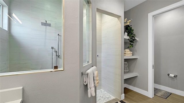 7551 Excitement Dr, Reunion, FL 34747 - full bathroom with a walk in shower and wood finished floors