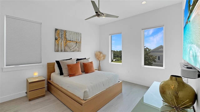7551 Excitement Dr, Reunion, FL 34747 - bedroom featuring light wood-style floors, recessed lighting, and a ceiling fan