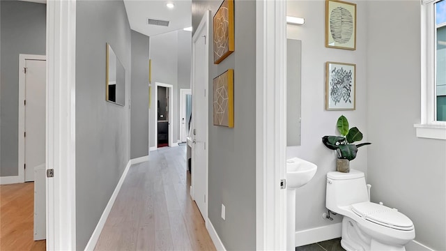 7551 Excitement Dr, Reunion, FL 34747 - hall featuring light wood-type flooring and baseboards