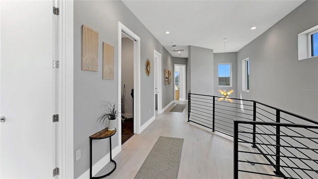 7551 Excitement Dr, Reunion, FL 34747 - corridor featuring an upstairs landing, wood finished floors, and recessed lighting