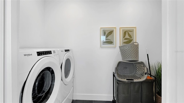 7551 Excitement Dr, Reunion, FL 34747 - laundry room featuring washing machine and dryer and baseboards