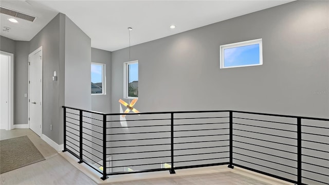 7551 Excitement Dr, Reunion, FL 34747 - hall with an upstairs landing and healthy amount of natural light