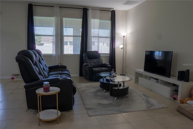 2712 Creekmore Ct, Kissimmee, FL 34746 - living room with healthy amount of natural light and light tile patterned floors
