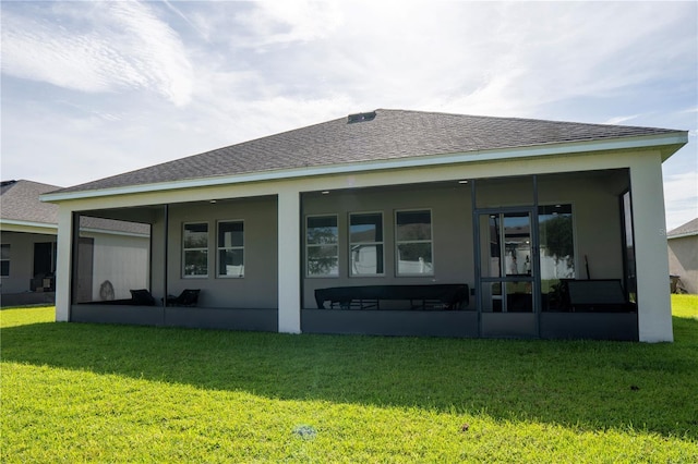 2712 Creekmore Ct, Kissimmee, FL 34746 - back of house featuring a sunroom, a lawn, roof with shingles, and stucco siding