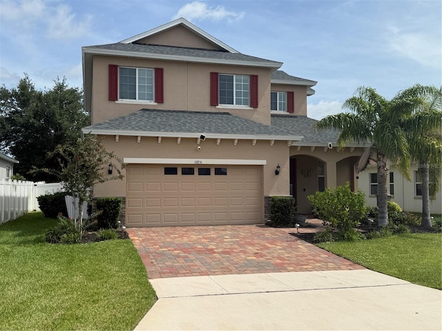 16856 Meadows St, Clermont, FL 34714 - traditional-style home with a shingled roof, stucco siding, decorative driveway, and an attached garage