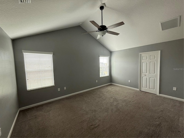 16856 Meadows St, Clermont, FL 34714 - carpeted empty room with a ceiling fan, lofted ceiling, and a textured ceiling