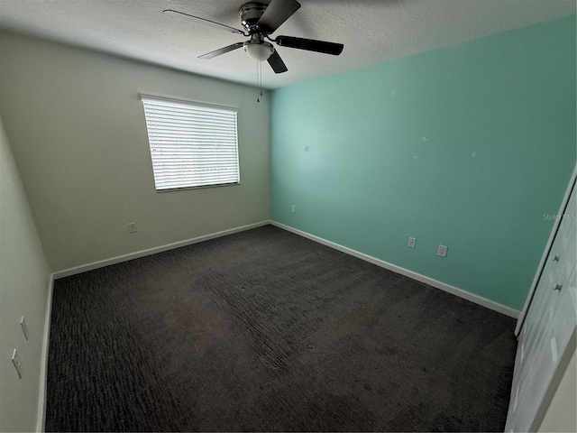 16856 Meadows St, Clermont, FL 34714 - empty room with a textured ceiling, a ceiling fan, and dark carpet