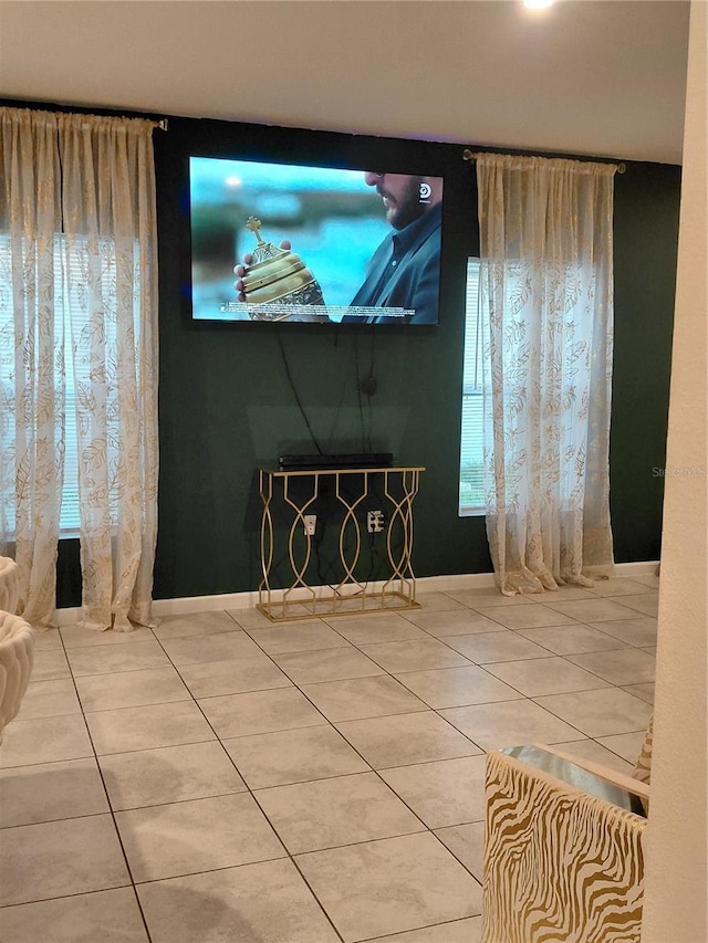 1509 Majestic, Winter Haven, FL 33880 - unfurnished living room featuring tile patterned flooring and healthy amount of natural light