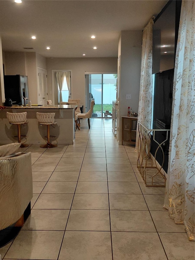 1509 Majestic, Winter Haven, FL 33880 - kitchen featuring fridge with ice dispenser, light tile patterned flooring, recessed lighting, and a peninsula