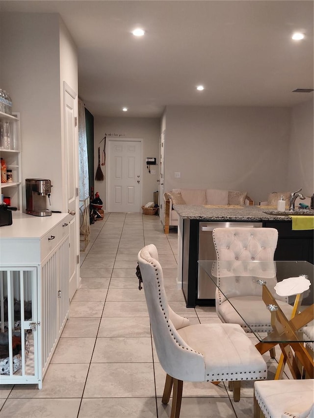 1509 Majestic, Winter Haven, FL 33880 - kitchen with recessed lighting, light tile patterned flooring, and light countertops
