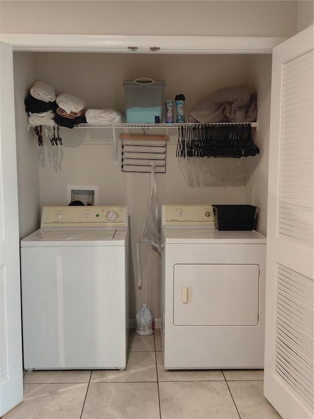 1509 Majestic, Winter Haven, FL 33880 - washroom featuring washer and dryer and light tile patterned floors