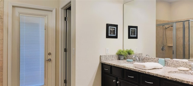 2183 Tripoli Ct, Kissimmee, FL 34747 - bathroom with double vanity and a shower stall