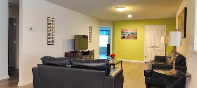 2183 Tripoli Ct, Kissimmee, FL 34747 - living area featuring light wood finished floors and baseboards