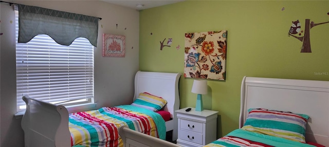 2183 Tripoli Ct, Kissimmee, FL 34747 - bedroom featuring multiple windows