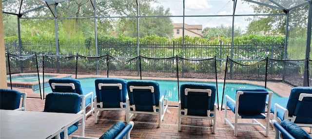 2183 Tripoli Ct, Kissimmee, FL 34747 - view of patio / terrace with an in-ground hot tub, an outdoor pool, and a lanai